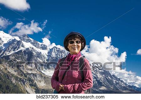 Older Japanese woman posing near mountain View Large Photo Image Stock Photography - Older Japanese woman posing near mountain. Fotosearch