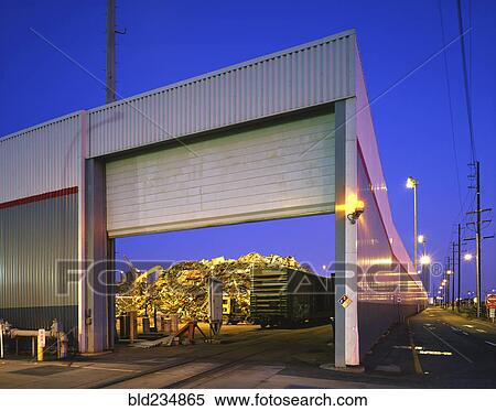 Stock Photography - Open garage door at junkyard. Fotosearch