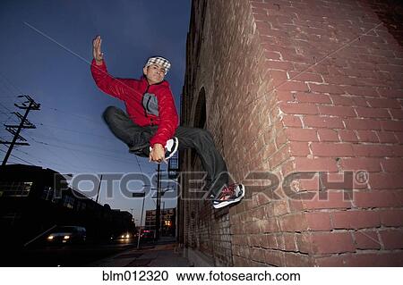 Pacific Islander man breakdancing in urban area View Large Photo Image Stock Image - Pacific Islander man breakdancing in urban area. Fotosearch