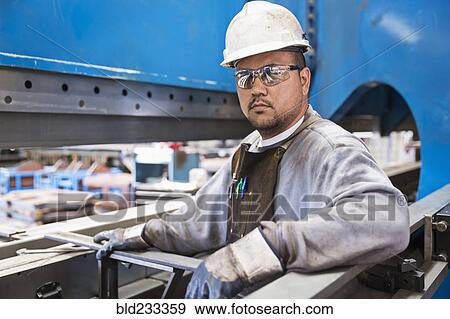 Pacific Islander worker posing in factory View Large Photo Image Stock Photo - Pacific Islander worker posing in factory. Fotosearch