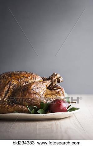 Stock Image - Pear on plate with cajun turkey. Fotosearch