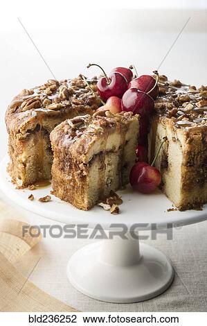 Stock Image - Pecan coffee cake with cherries. Fotosearch
