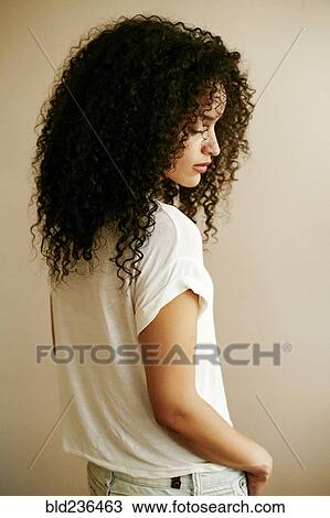 Pensive Hispanic woman looking down View Large Photo Image Stock Image - Pensive Hispanic woman looking down. Fotosearch