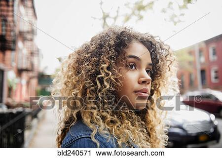 Pensive Mixed Race woman in city View Large Photo Image Stock Image - Pensive Mixed Race woman in city. Fotosearch
