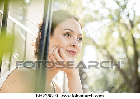 Pensive Thai woman with hand on chin View Large Photo Image Stock Photo - Pensive Thai woman with hand on chin. Fotosearch