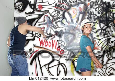 People tagging walls with graffiti View Large Photo Image Stock Image - People tagging walls with graffiti. Fotosearch
