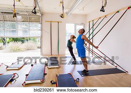 People using resistance bands in gymnasium View Large Photo Image Stock Image - People using resistance bands in gymnasium. Fotosearch