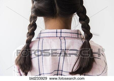 Pigtail braids of Mixed Race girl View Large Photo Image Stock Photo - Pigtail braids of Mixed Race girl . Fotosearch