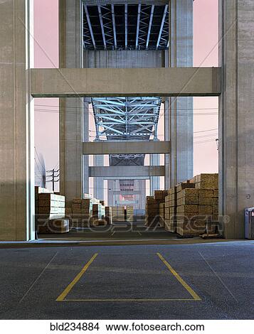 Pile of lumber under bridge View Large Photo Image Picture - Pile of lumber under bridge. Fotosearch