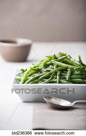 Pile of roasted green beans with spoon View Large Photo Image Stock Photograph - Pile of roasted green beans with spoon. Fotosearch