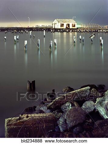 Pillars in still water at night View Large Photo Image Stock Photo - Pillars in still water at night. Fotosearch