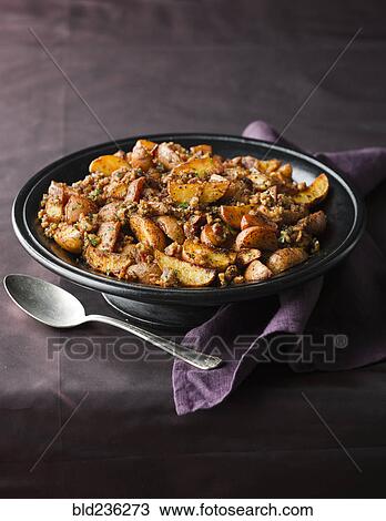 Plate of roasted potatoes and spoon View Large Photo Image Stock Image - Plate of roasted potatoes and spoon. Fotosearch