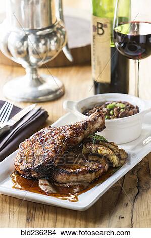 Picture - Pork chops and beans with red wine. Fotosearch
