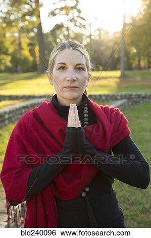 Portrait of Caucasian woman meditating in park View Large Photo Image Stock Photograph - Portrait of Caucasian woman meditating in park. Fotosearch