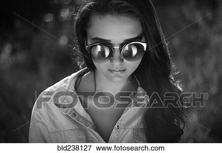 Portrait of Caucasian woman wearing sunglasses View Large Photo Image Stock Photo - Portrait of Caucasian woman wearing sunglasses. Fotosearch