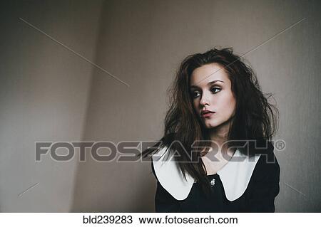 Portrait of Caucasian woman with messy hair near wall View Large Photo Image Stock Image - Portrait of Caucasian woman with messy hair near wall. Fotosearch