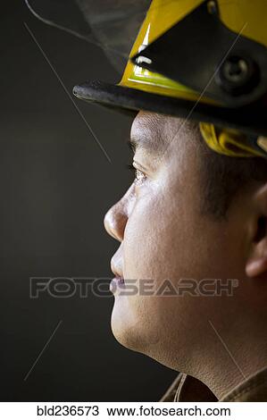 Stock Image - Portrait of Chinese fireman. Fotosearch