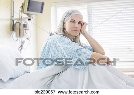 Portrait of frustrated Caucasian woman in hospital bed View Large Photo Image Stock Photo - Portrait of frustrated Caucasian woman in hospital bed. Fotosearch