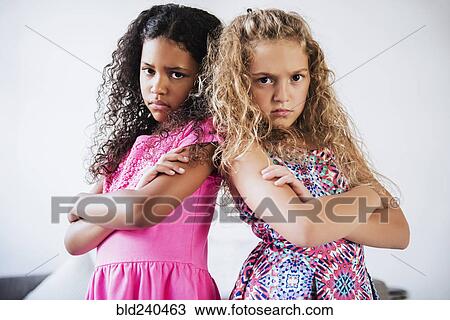 Stock Image - Portrait of girls with attitude. Fotosearch