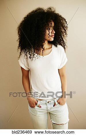 Stock Photo - Portrait of Hispanic woman looking away. Fotosearch