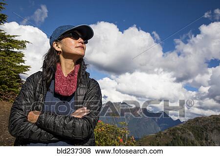 Stock Photo - Portrait of Japanese woman near mountain. Fotosearch