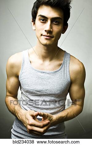 Stock Photo - Portrait of Mixed Race man wearing tank-top. Fotosearch