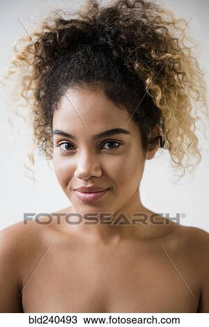 Stock Image - Portrait of Mixed Race woman with bare shoulders. Fotosearch