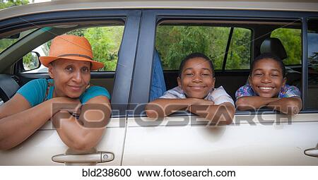 Portrait of mother and twin sons leaning on car windows View Large Photo Image Stock Image - Portrait of mother and twin sons leaning on car windows. Fotosearch