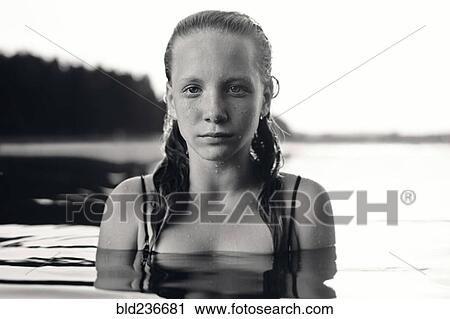 Portrait of serious Caucasian girl in lake View Large Photo Image Stock Image - Portrait of serious Caucasian girl in lake. Fotosearch
