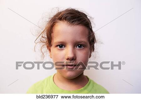 Stock Photo - Portrait of serious Caucasian girl. Fotosearch