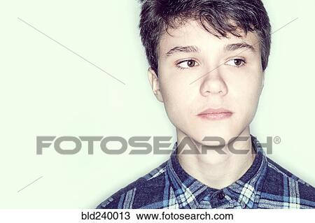 Stock Image - Portrait of serious Caucasian teenage boy. Fotosearch