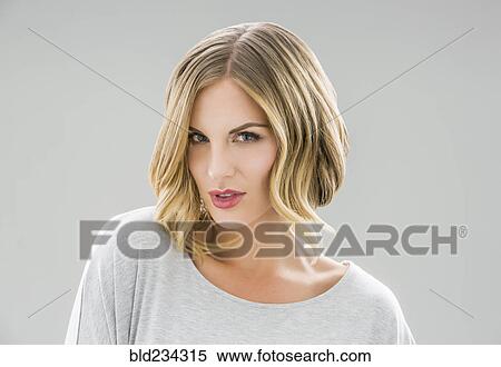 Stock Photography - Portrait of serious Caucasian woman. Fotosearch