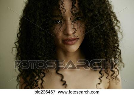 Stock Photo - Portrait of serious Hispanic woman. Fotosearch