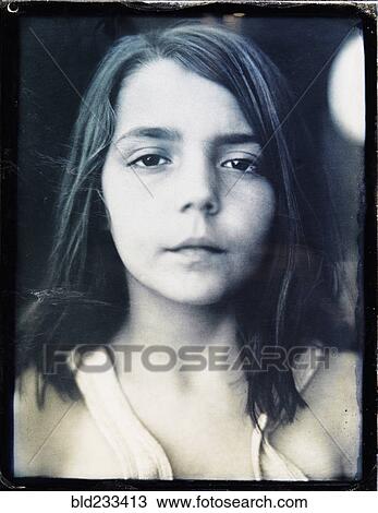 Stock Image - Portrait of serious Mixed Race girl. Fotosearch