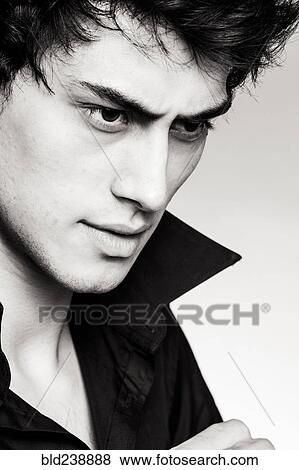 Stock Photo - Portrait of serious Mixed Race man. Fotosearch