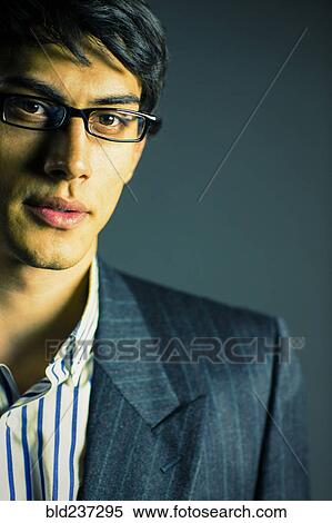 Portrait of serious Mixed Race businessman View Large Photo Image Stock Photography - Portrait of serious Mixed Race businessman. Fotosearch