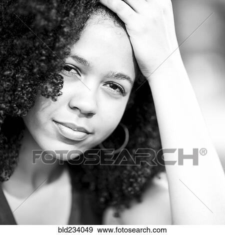 Portrait of serious Mixed Race woman View Large Photo Image Stock Photo - Portrait of serious Mixed Race woman . Fotosearch