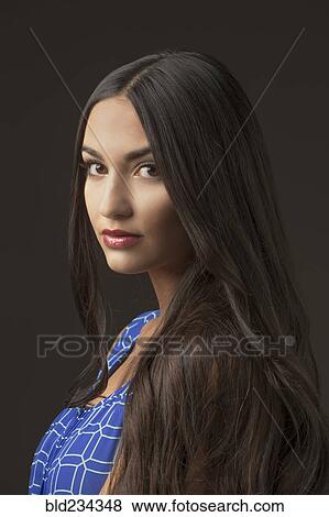 Portrait of serious Mixed Race woman View Large Photo Image Stock Photo - Portrait of serious Mixed Race woman. Fotosearch
