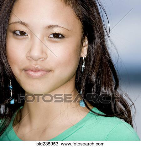Portrait of smiling Asian girl View Large Photo Image Stock Image - Portrait of smiling Asian girl. Fotosearch
