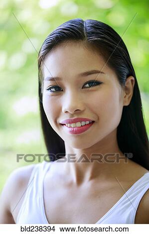 Portrait of smiling Asian teenage girl View Large Photo Image Picture - Portrait of smiling Asian teenage girl. Fotosearch