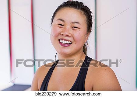 Portrait of smiling Asian woman View Large Photo Image Stock Photo - Portrait of smiling Asian woman. Fotosearch