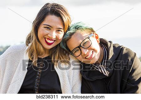 Portrait of smiling Asian women View Large Photo Image Stock Image - Portrait of smiling Asian women. Fotosearch