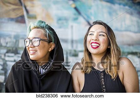 Stock Photograph - Portrait of smiling Asian women. Fotosearch