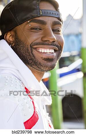 Stock Photo - Portrait of smiling Black man . Fotosearch