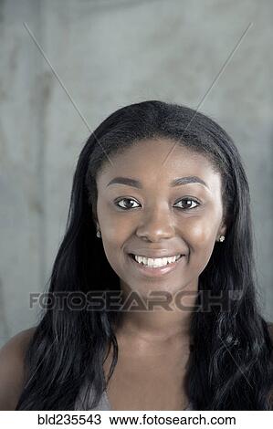 Portrait of smiling Black woman View Large Photo Image Stock Image - Portrait of smiling Black woman. Fotosearch