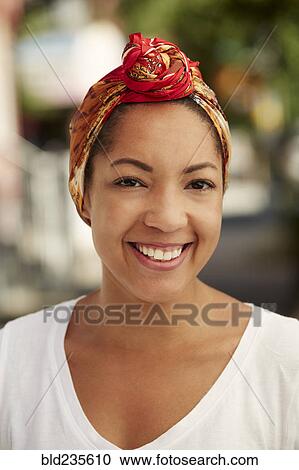 Portrait of smiling Black woman wearing headscarf View Large Photo Image Stock Image - Portrait of smiling Black woman wearing headscarf. Fotosearch