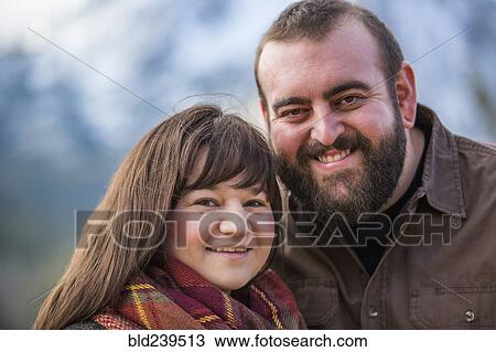 Stock Image - Portrait of smiling Caucasian couple. Fotosearch