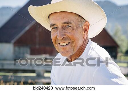 Portrait of smiling Caucasian farmer View Large Photo Image Stock Image - Portrait of smiling Caucasian farmer. Fotosearch