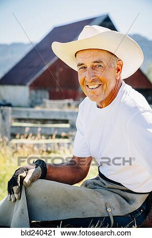 Stock Image - Portrait of smiling Caucasian farmer. Fotosearch