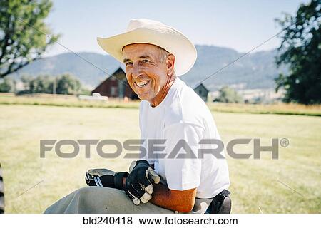 Portrait of smiling Caucasian farmer View Large Photo Image Stock Photo - Portrait of smiling Caucasian farmer. Fotosearch